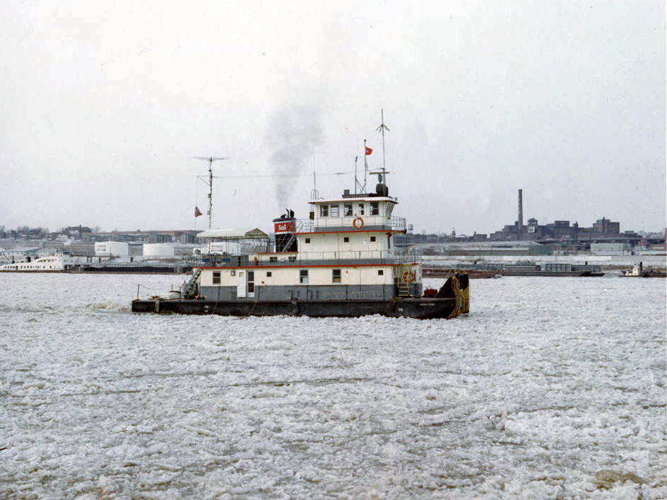 side view of a small white ship on an icy river side view of a small white ship on an icy river